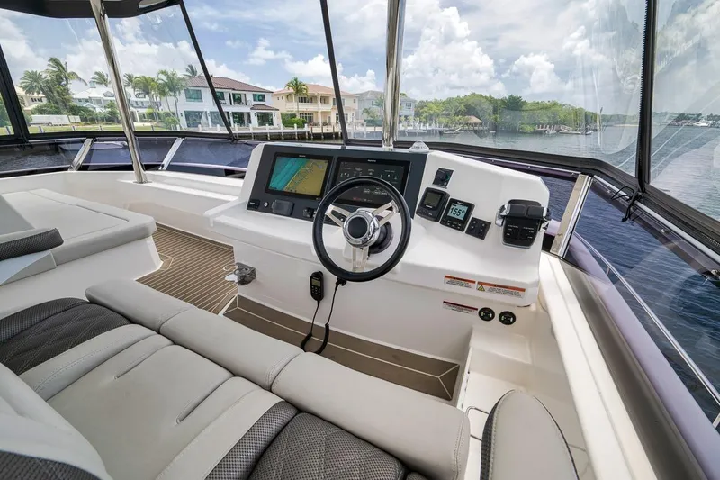 Slide: The Image of Helm of 2024 Leopard 46 Powercat with modern navigation equipment and waterfront view. - 40