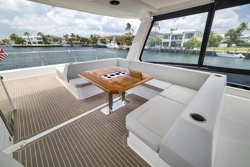 Slide: The Image of Luxurious 2024 Leopard 46 Powercat yacht interior with elegant seating and waterfront view. - 41