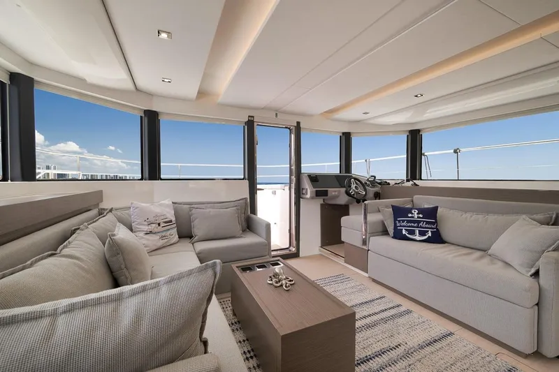 Slide: The Image of Luxurious interior of 2024 Leopard 46 Powercat yacht with plush seating and panoramic windows. - 49