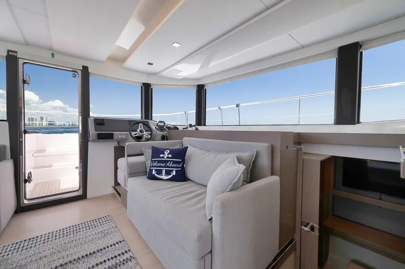 Slide: The Image of Interior of 2024 Leopard 46 Powercat yacht with modern seating and ocean view. - 53