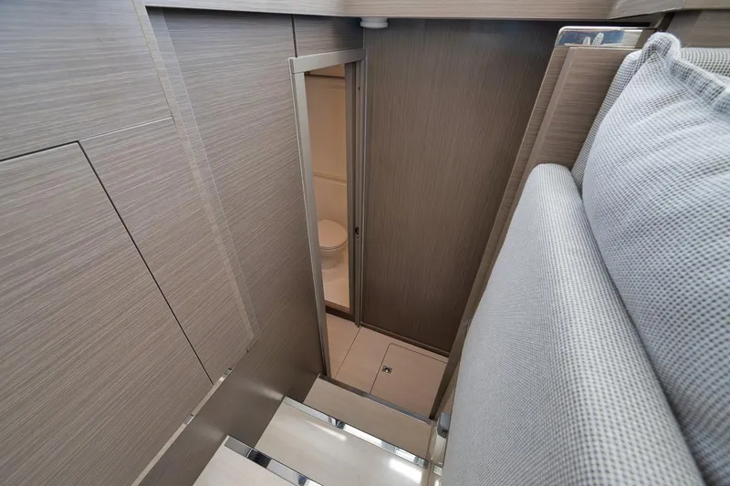 Slide: The Image of Interior view of 2024 Leopard 46 Powercat, featuring a compact bathroom space. - 59