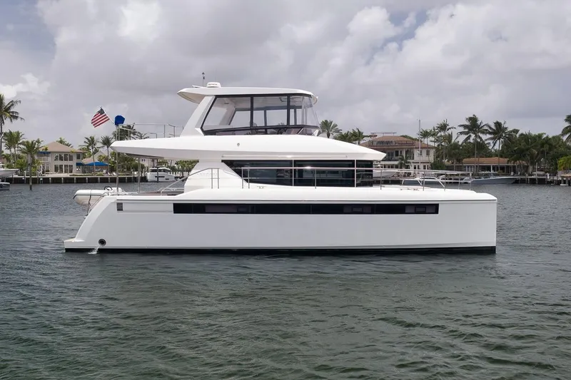 Slide: The Image of 2024 Leopard 46 Powercat yacht on calm water, showcasing sleek design and modern architecture. - 8