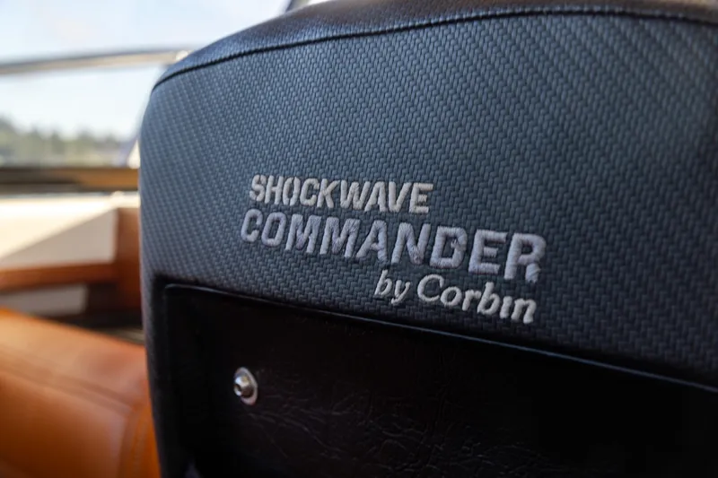 Slide: The Image of Shockwave Commander seat detail in 2025 Ocean Sport Roamer boat interior. - 28