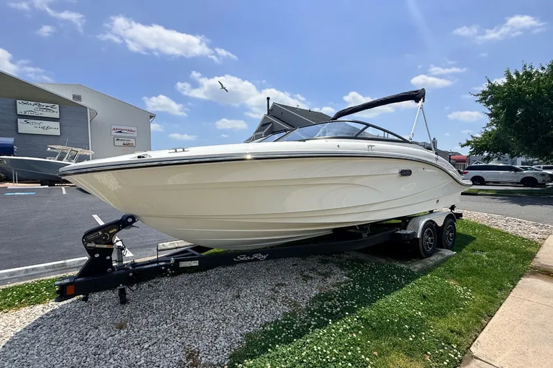 Slide: The Image of 2026 Sea Ray SPX 210 Outboard on trailer in sunny weather. - 0