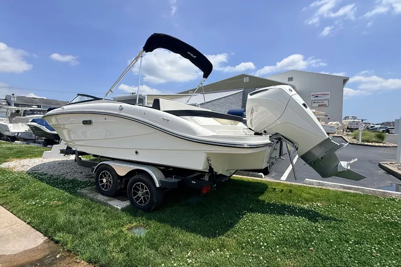 Slide: The Image of 2026 Sea Ray SPX 210 Outboard on trailer outdoors. - 1