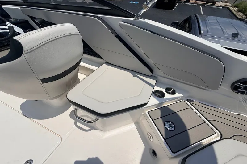 Slide: The Image of Interior of 2026 Sea Ray SPX 210 Outboard with seating and storage. - 6