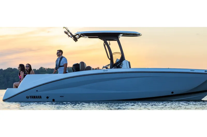 Slide: The Image of Yamaha 255 FSH Sport H 2026 boat on water at sunset. - 8