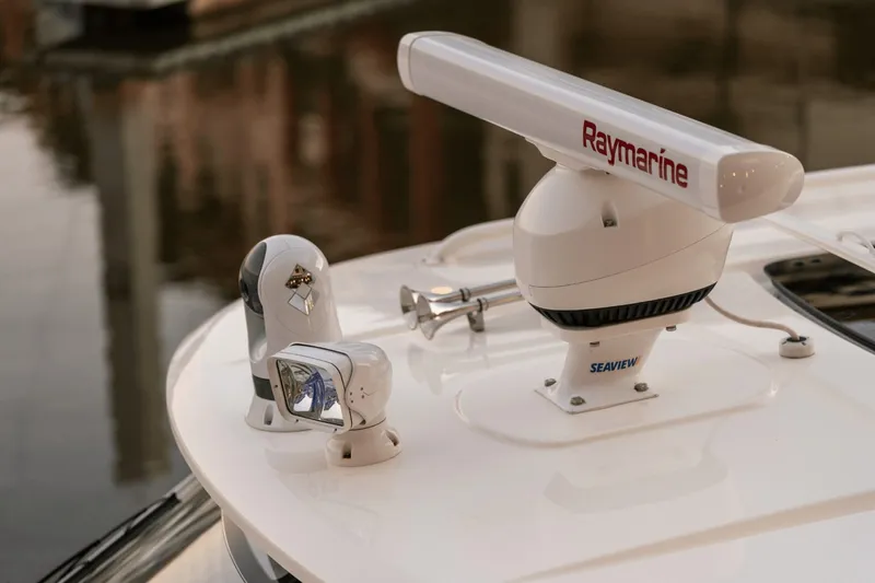 Slide: The Image of Close-up of a radar system and camera on a boat. - 47