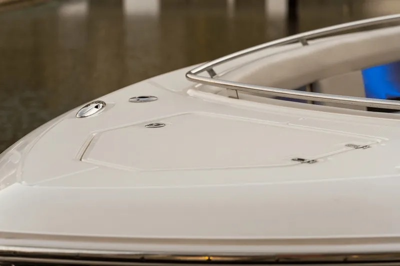 Slide: The Image of The bow of a 2027 Boston Whaler 380 Realm with sleek lines and stainless steel railing. - 46