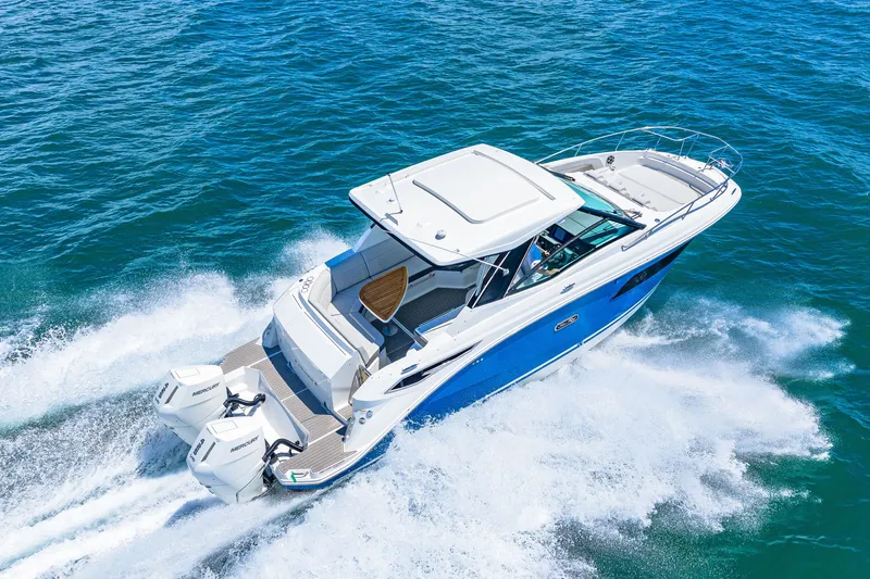 Slide: The Image of Sea Ray Sundancer 320 Outboard 2027 on the water, featuring twin outboard engines and sleek design. - 17