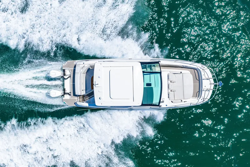 Slide: The Image of Aerial view of a Sea Ray Sundancer 320 Outboard speeding across the water. - 7