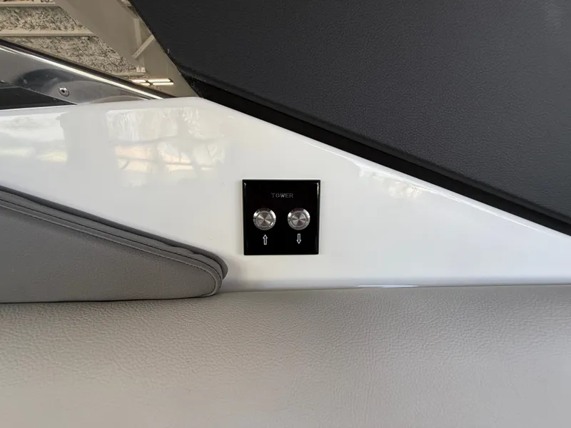 Slide: The Image of Close-up of a control panel with two buttons on a Sea Ray SLX 280 Outboard. - 20
