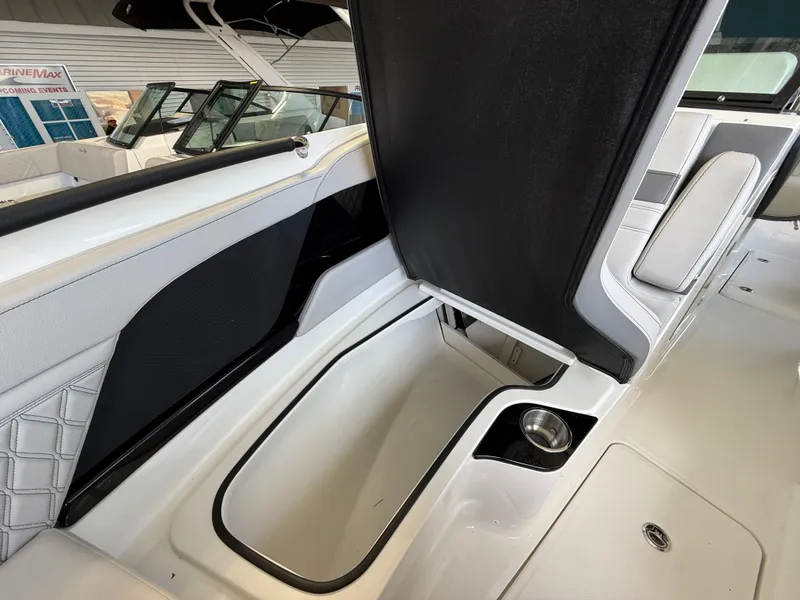Slide: The Image of Interior of a Sea Ray SLX 280 Outboard with storage compartment and sleek seating. - 6