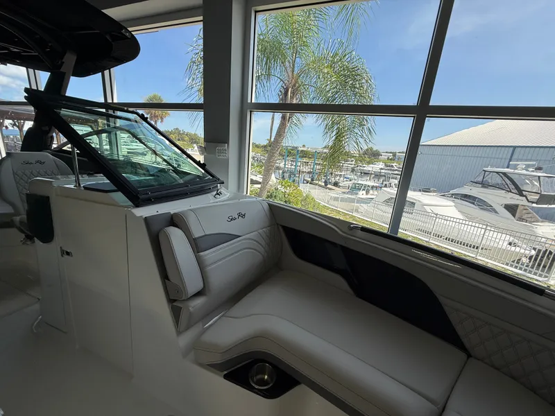Slide: The Image of The interior of a 2027 Sea Ray SLX 280 Outboard with luxurious seating and large windows. - 3