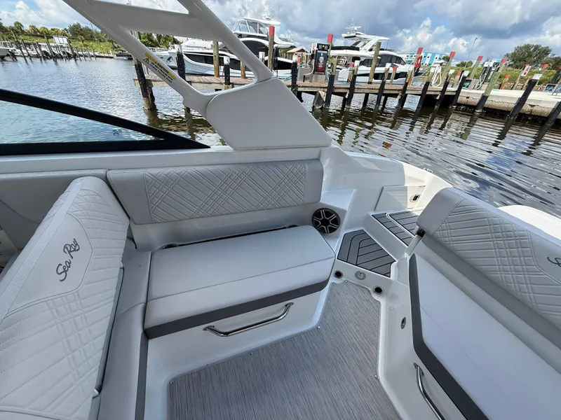 Slide: The Image of Interior view of a Sea Ray SDX 270 Outboard with sleek white seating and modern design. - 18