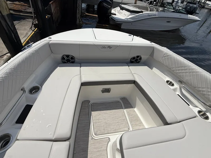 Slide: The Image of The image shows the spacious bow area of a Sea Ray SDX 270 Outboard with cushioned seating. - 3