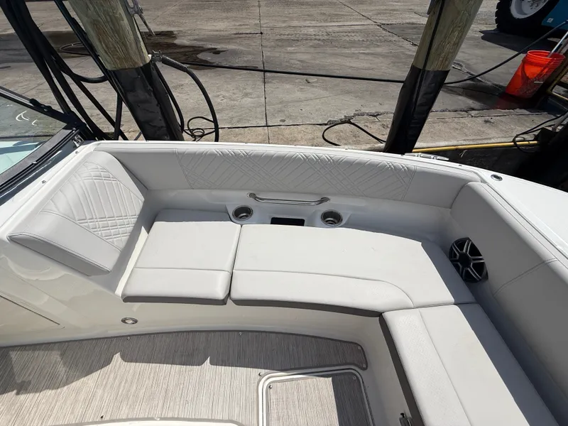Slide: The Image of The image shows the seating area of a Sea Ray SDX 270 Outboard with white upholstery. - 6