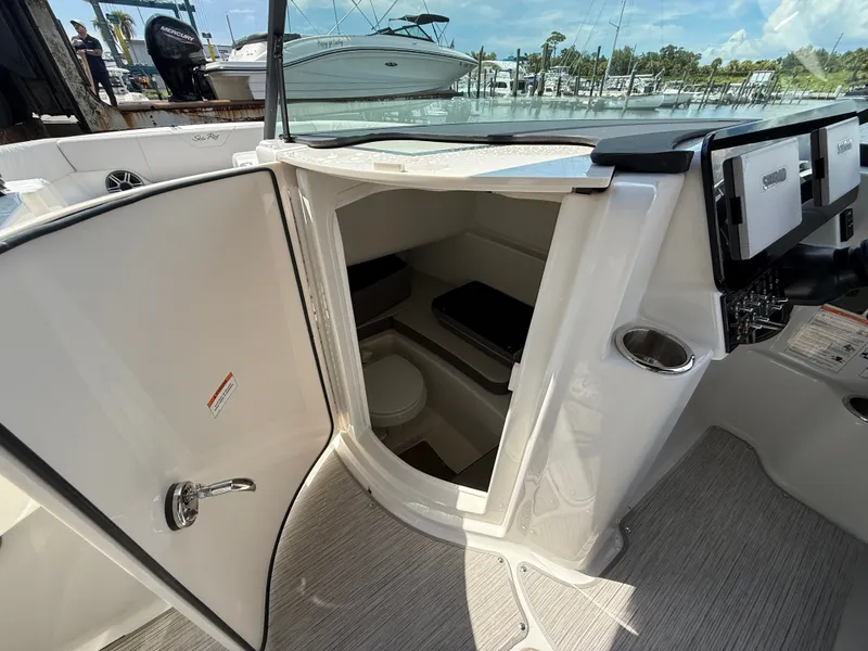 Slide: The Image of Interior view of the Sea Ray SDX 270 Outboard with cabin and toilet. - 15