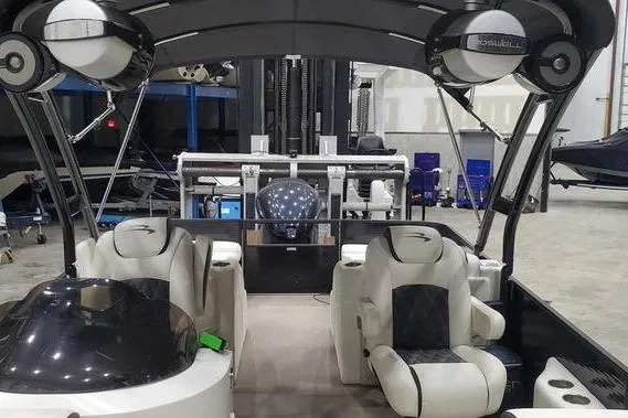 Slide: The Image of 2018 Bennington 23 GCWA pontoon boat interior with plush seating and modern design. - 10
