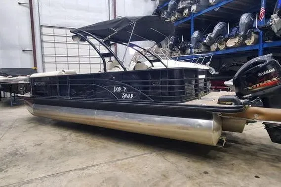 Slide: The Image of 2018 Bennington 23 GCWA pontoon boat with Yamaha outboard in storage facility. - 3