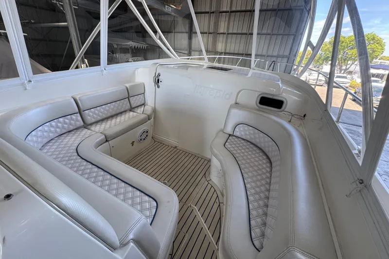 Slide: The Image of Luxurious seating area on a 2006 Intrepid 377 Walkaround boat, featuring elegant upholstery. - 11
