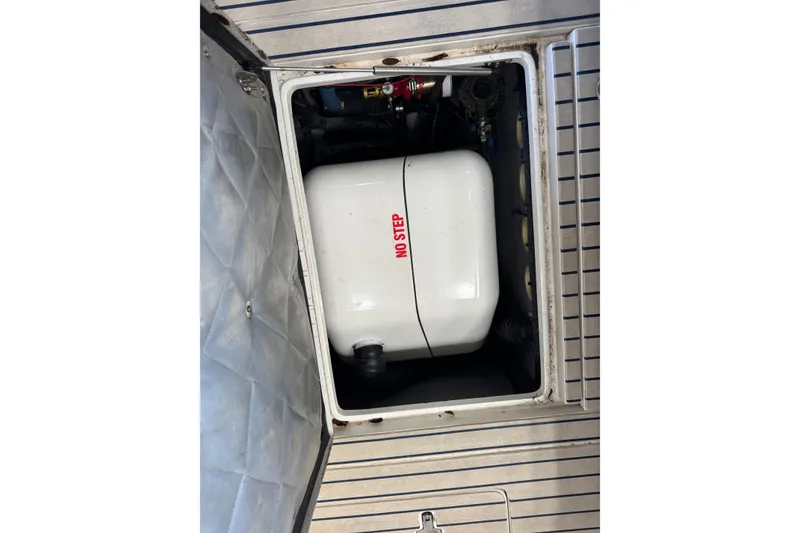 Slide: The Image of Engine compartment of a 2006 Intrepid 377 Walkaround boat with "No Step" label. - 19