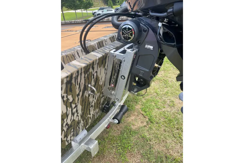 Slide: The Image of Avid 20 Rogue CC 2026 boat with camouflage design and motor detail. - 17