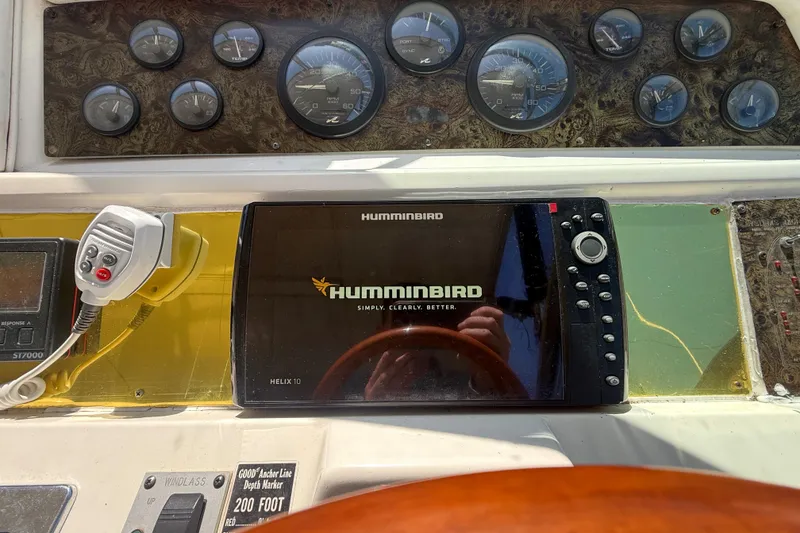 Slide: The Image of Control panel of a 1996 Sea Ray 400 Express Cruiser with Humminbird Helix 10 display. - 21