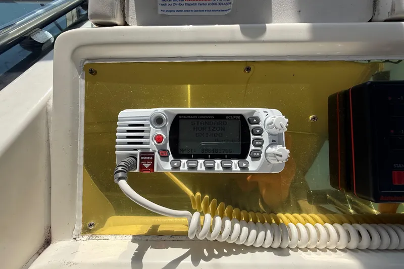 Slide: The Image of VHF radio on 1996 Sea Ray 400 Express Cruiser dashboard, displaying Standard Horizon model. - 22