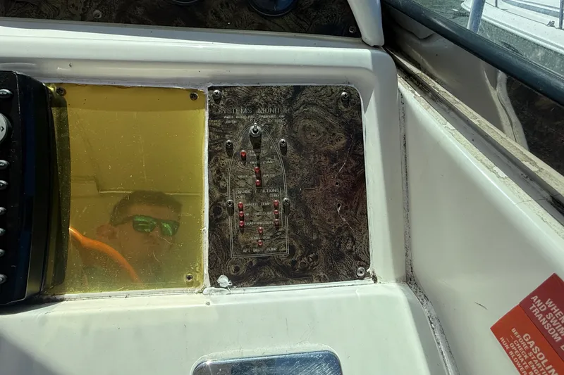 Slide: The Image of Control panel of a 1996 Sea Ray 400 Express Cruiser with reflection in yellow screen. - 24