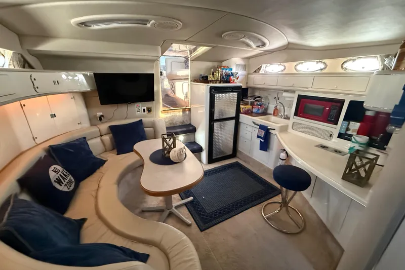 Slide: The Image of Luxurious interior of a 1996 Sea Ray 400 Express Cruiser with modern amenities. - 41