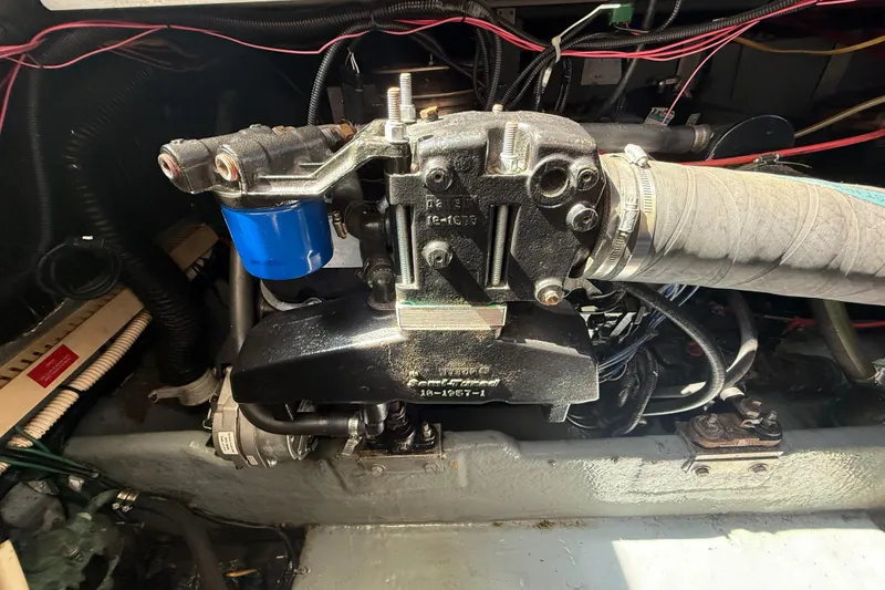 Slide: The Image of Engine compartment of a 1996 Sea Ray 400 Express Cruiser with visible components and wiring. - 62