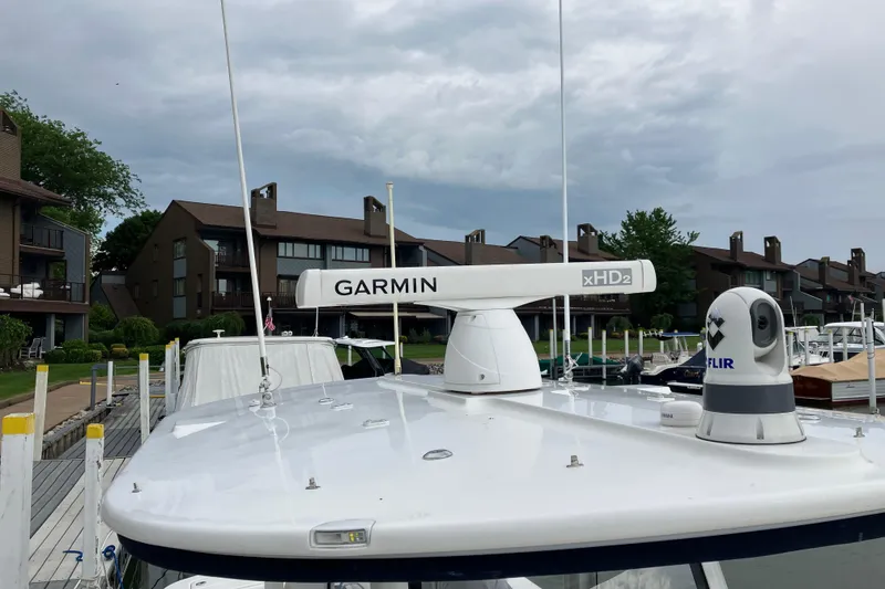 Slide: The Image of 2021 Regulator 31 boat with Garmin xHD2 radar and FLIR camera at a marina. - 10