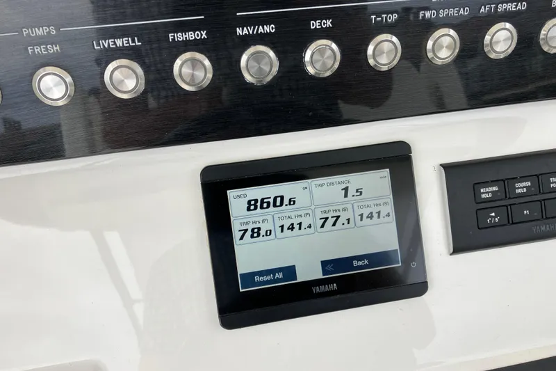 Slide: The Image of Control panel of a 2021 Regulator 31 boat with Yamaha display showing trip data. - 13