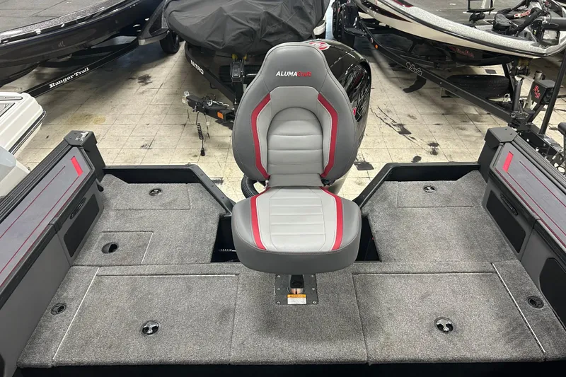 Slide: The Image of 2025 Alumacraft Trophy 185X Sport boat interior with gray and red seating. - 7
