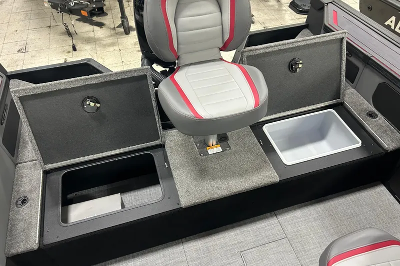 Slide: The Image of 2025 Alumacraft Trophy 185X Sport interior with storage compartments and seating. - 8