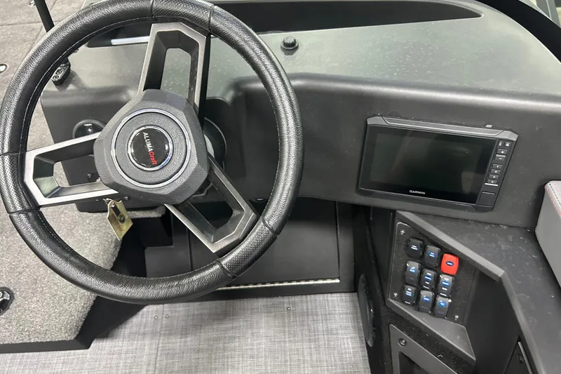 Slide: The Image of Steering wheel and dashboard of 2025 Alumacraft Trophy 185X Sport boat. - 9