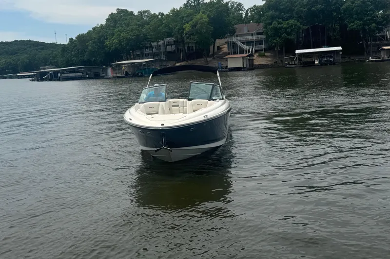 Slide: The Image of 2006 Sea Ray 270 SLX boat on a calm lake with wooded shoreline. - 10