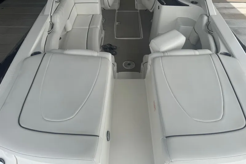 Slide: The Image of Interior view of a 2006 Sea Ray 270 SLX boat with white seating. - 12