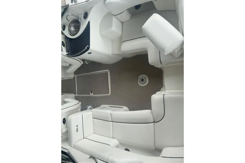 Slide: The Image of Interior view of 2006 Sea Ray 270 SLX boat with white seating and sleek design. - 13