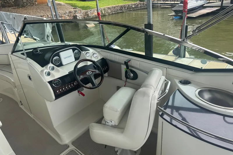 Slide: The Image of Interior of a 2006 Sea Ray 270 SLX boat with steering wheel and dashboard. - 16