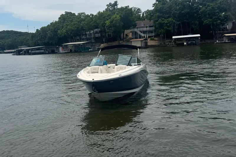 Slide: The Image of 2006 Sea Ray 270 SLX boat on a calm lake with wooded shoreline. - 9