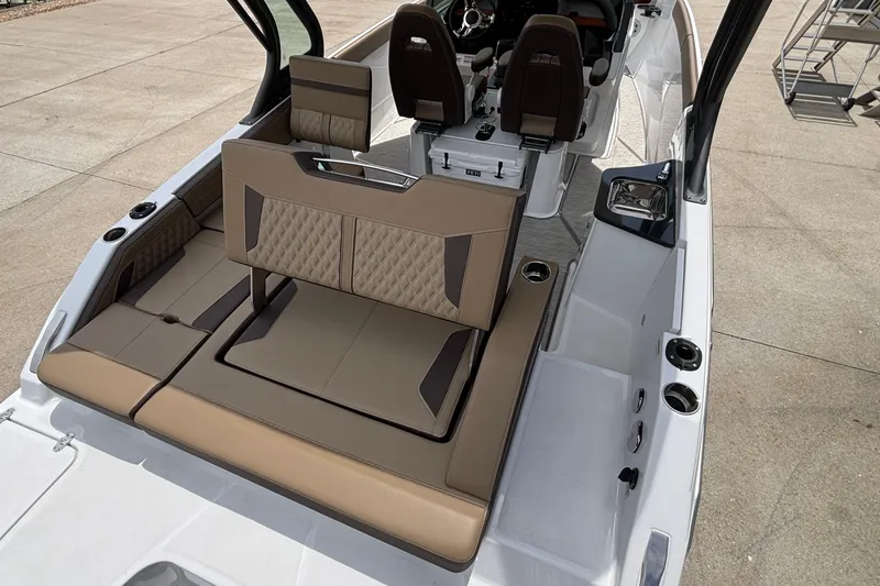 Slide: The Image of 2026 Monterey Elite 27 OB boat interior with luxurious seating and modern design. - 14