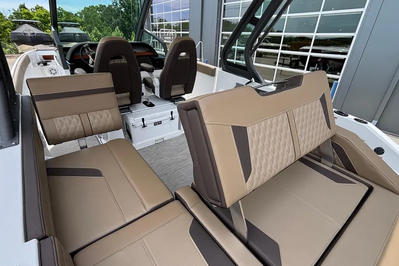 Slide: The Image of Luxurious interior of 2026 Monterey Elite 27 OB boat with stylish seating. - 16