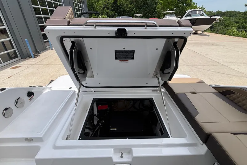 Slide: The Image of Open engine compartment of 2026 Monterey Elite 27 OB boat, showcasing interior details. - 18