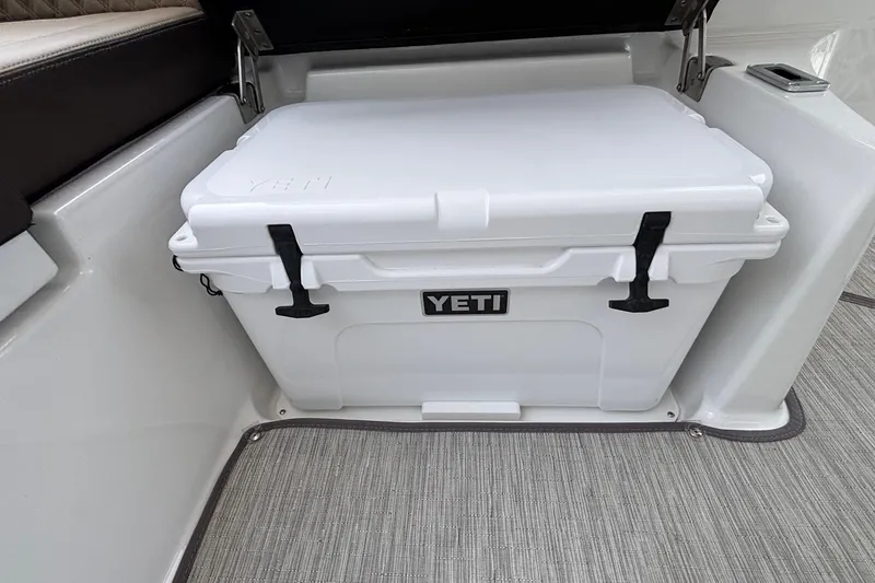 Slide: The Image of White Yeti cooler on 2026 Monterey Elite 27 OB boat interior. - 22