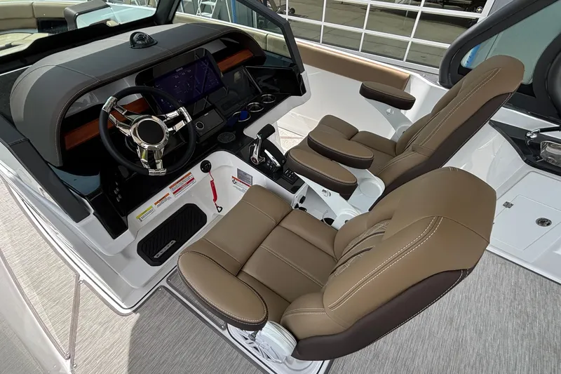 Slide: The Image of 2026 Monterey Elite 27 OB boat interior with modern dashboard and luxurious seating. - 25