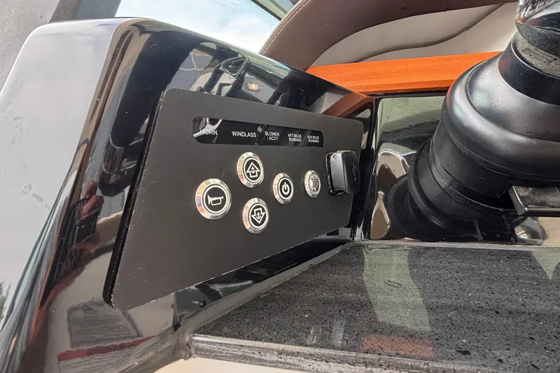 Slide: The Image of Control panel of 2026 Monterey Elite 27 OB boat with various function buttons. - 28