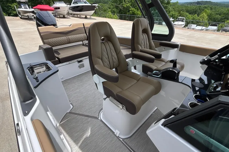 Slide: The Image of Luxurious interior of 2026 Monterey Elite 27 OB boat with plush seating and modern design. - 34