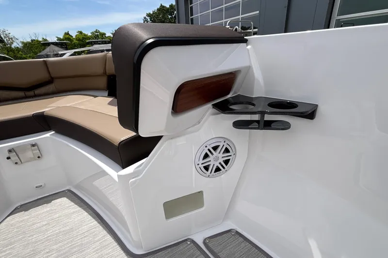 Slide: The Image of 2026 Monterey Elite 27 OB boat interior with seating, speaker, and cup holders. - 36